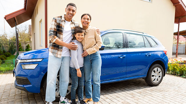 auto loan rates syracuse ny by secny fcu familt in front of newly financed car