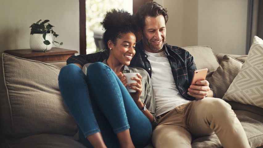 mortgage loans near syracuse ny image of happy couple on brand new couch