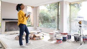 home equity loan rates near syracuse ny woman looking at home improvement plans