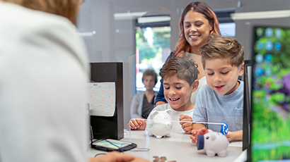 kids banking near syracuse ny from secny fcu kids handing over allowance at bank