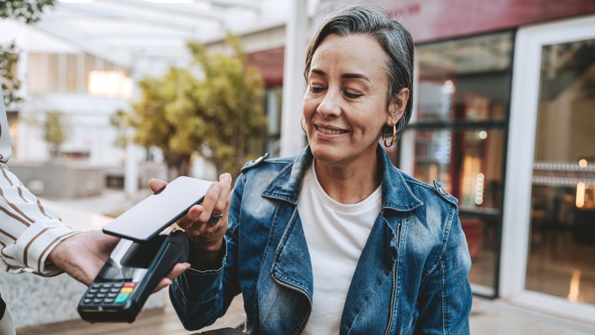 samsung pay digital wallet near syracuse ny image of woman using secny fcu phone bill pay function at restaurant