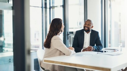 small business loans near syracuse ny panel image of banker talking with client