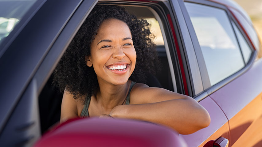 loan protection near syracuse ny college student smiling in car