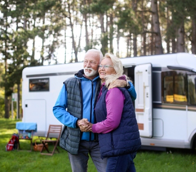 rv loans near syracuse ny retired couple in front of rv
