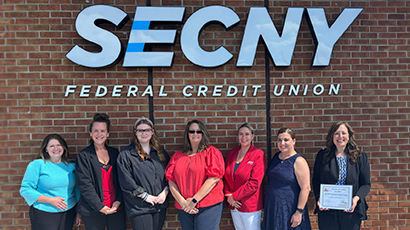 about credit unions near syracuse ny from secny fcu employees standing outside building