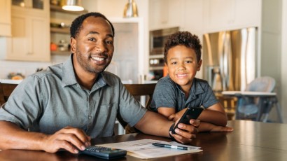 youth accounts near syracuse ny panel image for yong adult opening a bank account with father at home with calculator and phone